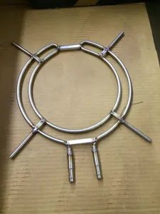Bent and TIG welded stainless tube ring assembly laid out on cardboard