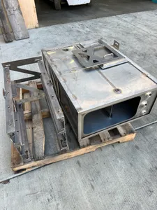 Fabricated stainless steel enclosure and frame sections on a pallet ready for delivery